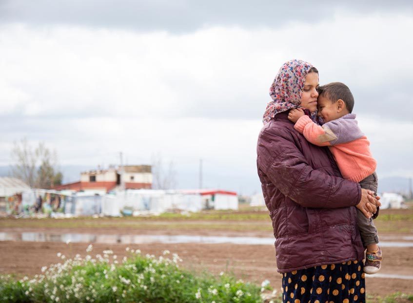 Randa Al Abed, 23, pictured holding her youngest son, Jasem Al Mohammad, Bekaa Valley, Lebanon, April 2019. Elie Gardner/RI