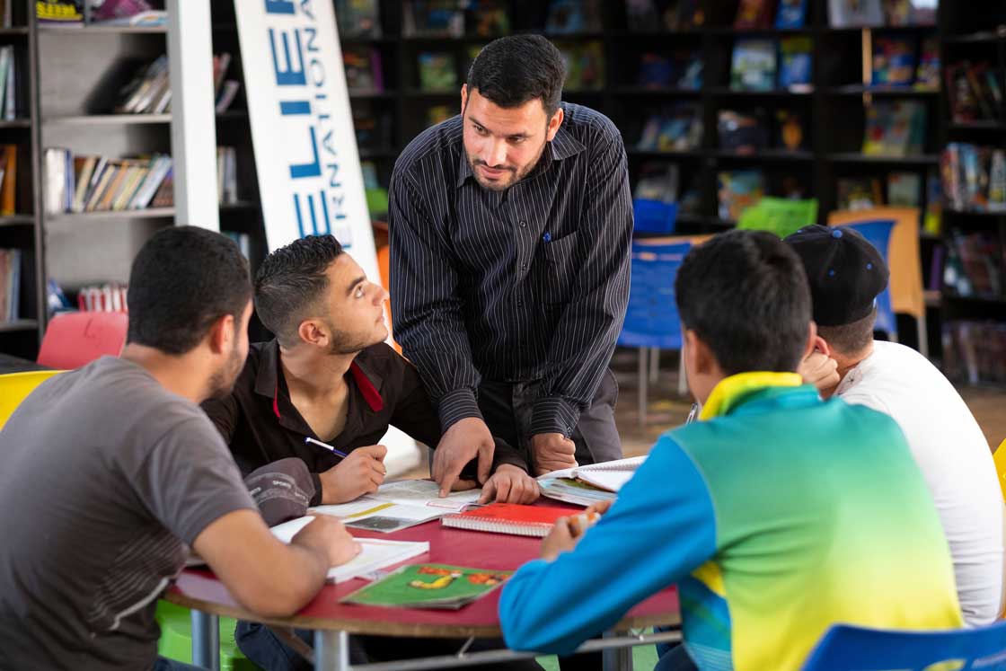 Students study in the library at Relief International's Center 1 in Zaatari refugee camp in Jordan. Elie Gardner/RI