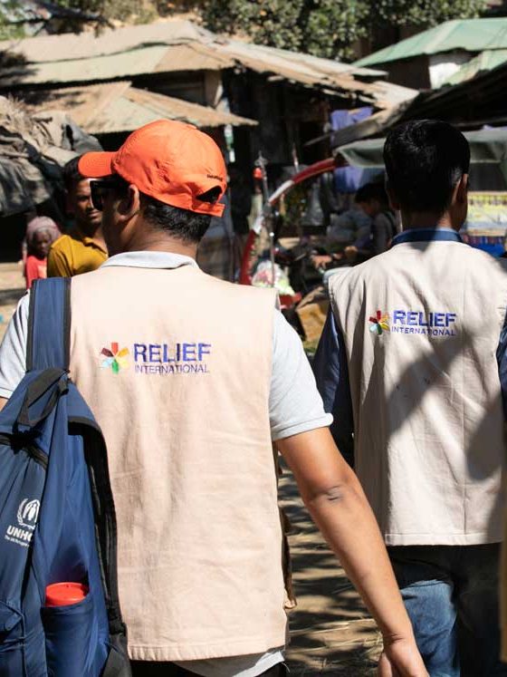 Teams walk through Bangladesh's crowded Kutupalong refugee camp to to reach remote areas of the camp. Rachel Elkind/RI