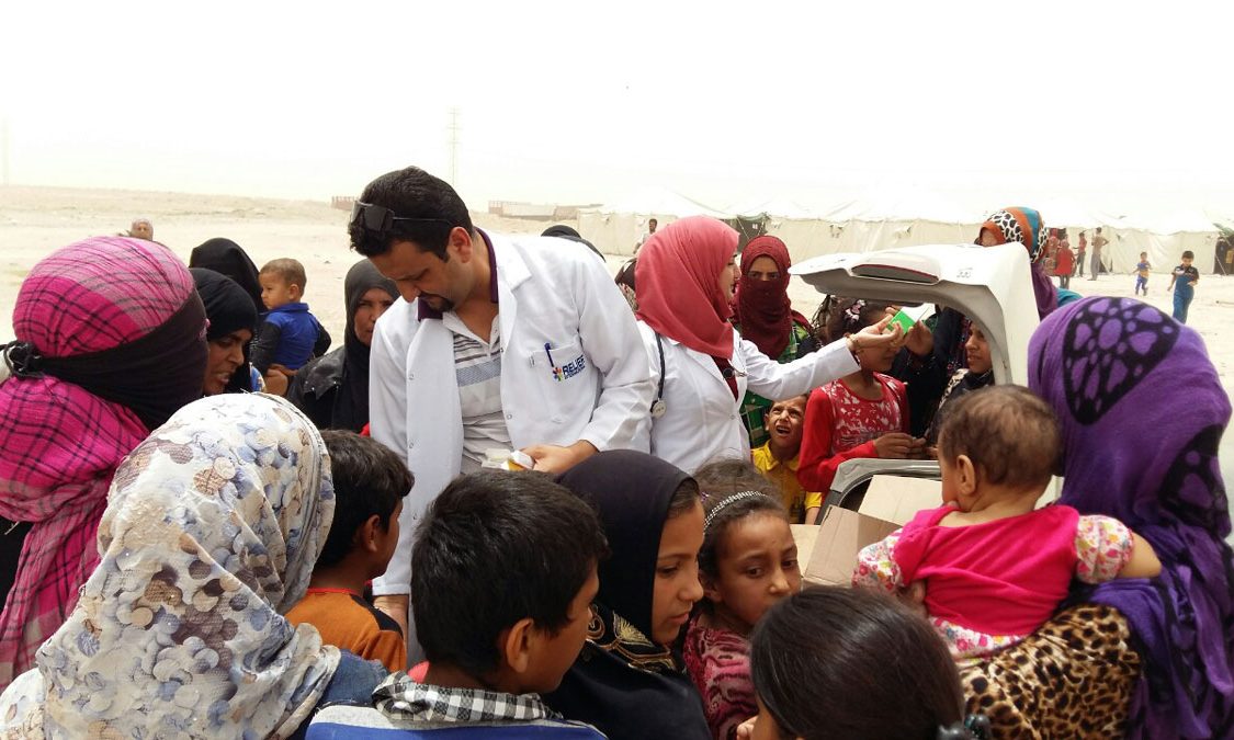 Relief International staff distribute critical medical and hygiene supplies to displaced families in Anbar, Iraq. RI Staff/RI Relief International staff distribute critical medical and hygiene supplies to displaced families in Anbar, Iraq. RI Staff/RI