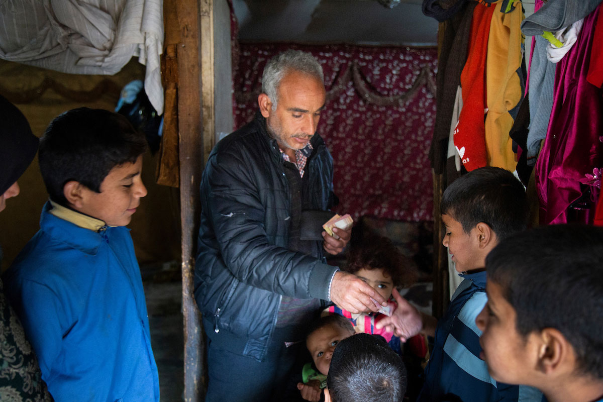 Mohammad Al Sayyah uses part of the cash assistance he receives from Relief International to pay for his sons' school lunches. Elie Gardner/RI