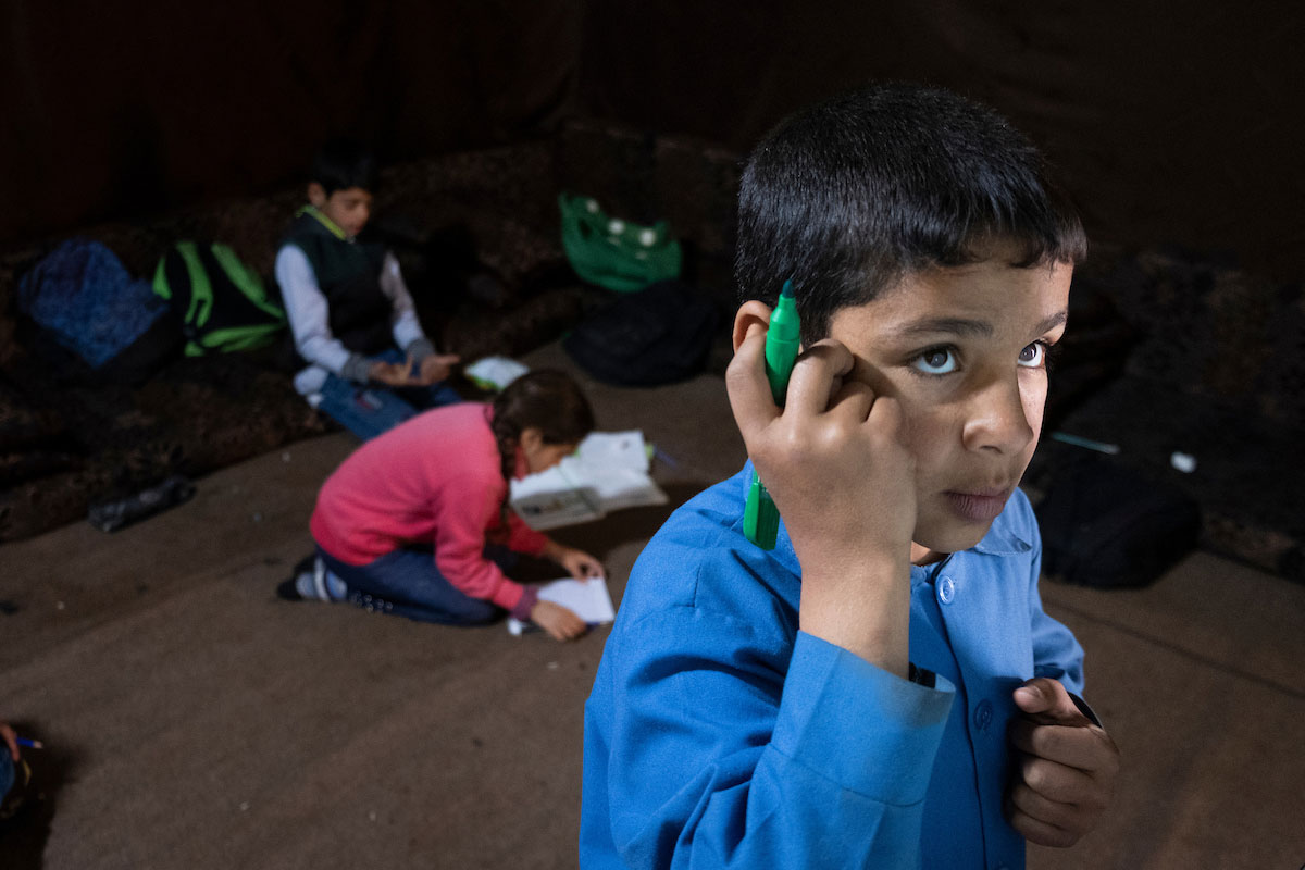 Rahim concentrates on solving multiplication drills during Relief International's Homework Support Group. He is at the top of his class. Elie Gardner/RI