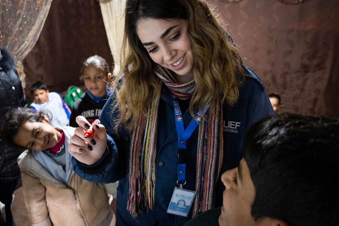 Relief International's Cash for Education Field Assistant Layal Al Sayed leads a homework support group once a week for two hours in an informal settlement of Syrian refugees in Lebanon's Bekaa Valley. Elie Gardner/RI