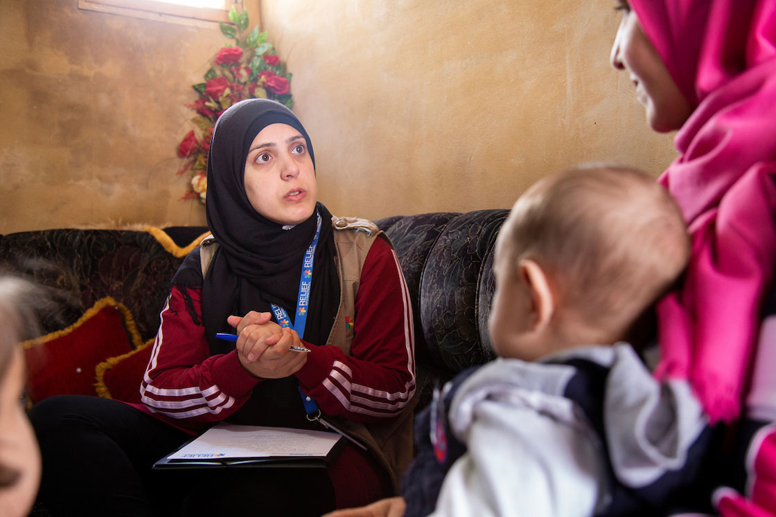 Relief International Social Worker Fatima Abdul Wahed hosts a one-on-one session with Aasma in her home. Elie Gardner/RI