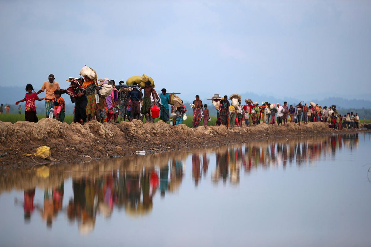 Rohingya refugees continue their way after crossing from Myanmar into Palang Khali, near Cox's Bazar in Bangladesh. Hannah McKay/Reuters