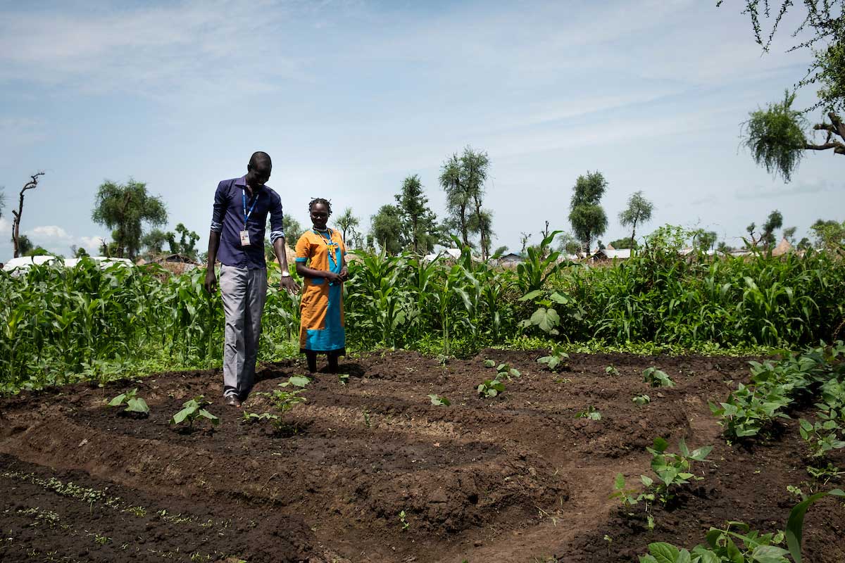 Khartuma Lamar, 22, planted a kitchen garden after training, support and a referral when her daughter Susan, 2, was a patient being treated for malnourishment.  Elie Gardner/RI