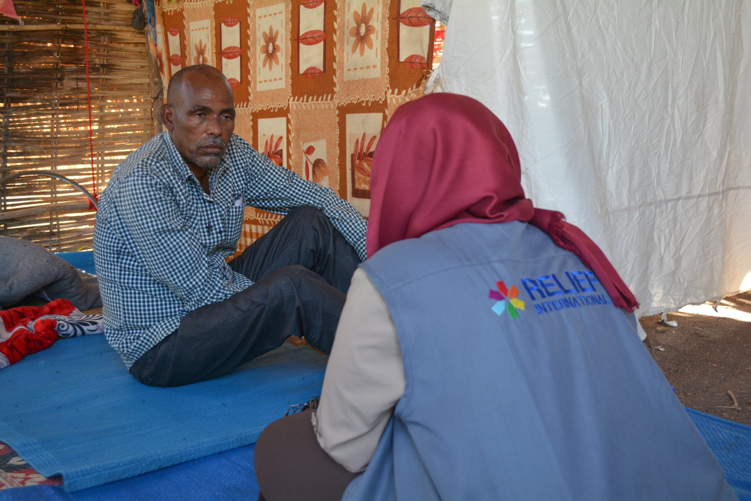 RI-Staff-Meeting-with-the-Refugee-Population-in-Um-Rakuba-scaled.jpg RI-Staff-Meeting-with-the-Refugee-Population-in-Um-Rakuba-scaled.jpg