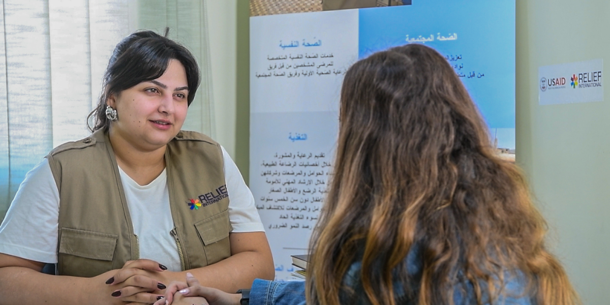 RI Mental Health Worker, Rasha, from Lebanon speaking to service user.